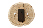 iphone mobile phone, smartphone, touch screen, make a phone call, communication, technology, mobile, cellular, headphones, tree trunk, wood, isolated, cut out